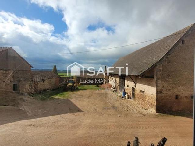 MAISON DE CARACTERE AVEC TERRE ET BATIMENTS AGRICOLE