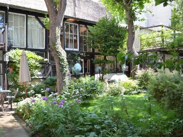 Maison et atelier dans un écrin de verdure 236m² Paris 14ème