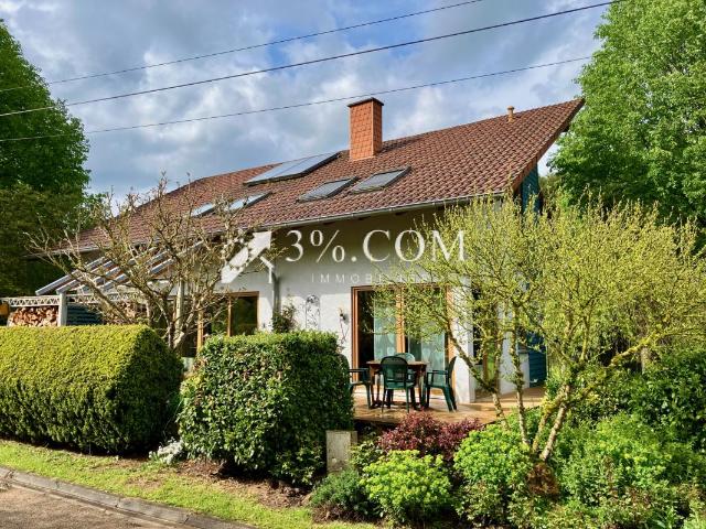 Maison ossature bois avec grand terrain paysager