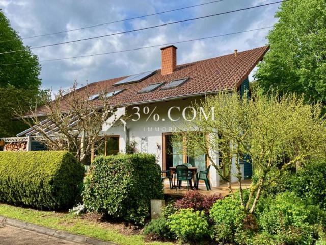 Maison ossature bois avec grand terrain paysager