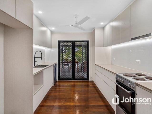 MASSIVE DECK, MODERN KITCHEN AND ENDLESS POTENTIAL IN A PRIME LOCATION!