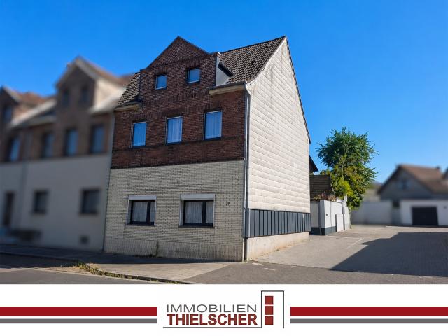 Mehrfamilienhaus mit drei vermieteten Wohneinheiten und Gartenanteil in Übach Palenberg