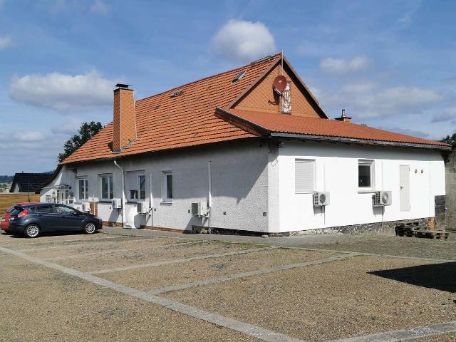 Mehrfamilienhaus mit Gewerbeanbau Büros inkl. Bauland