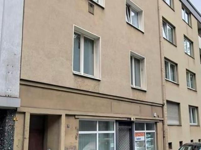 Mehrfamilienhaus mit Ladenkoal