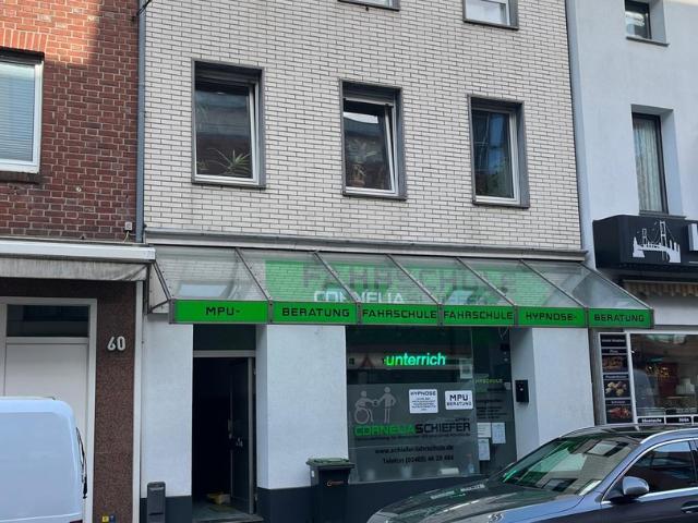 Mehrfamilienhaus mit Ladenlokal in zentraler Lage