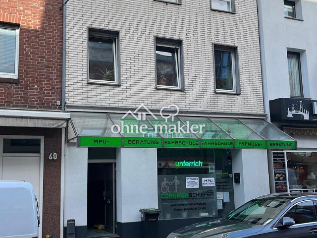 Mehrfamilienhaus mit Ladenlokal in zentraler Lage