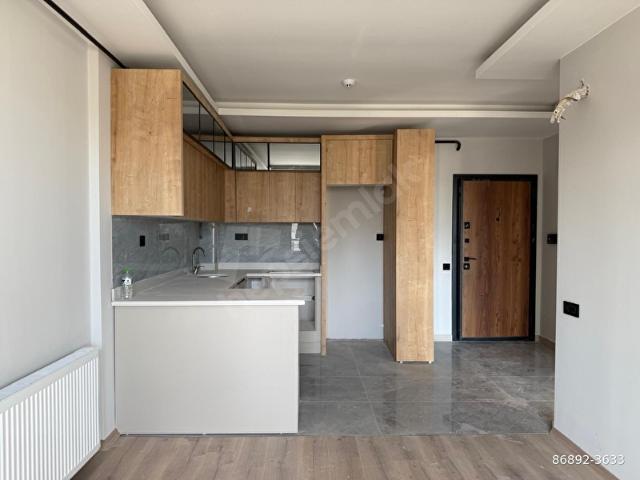 MEZİTLİ AKDENİZ MAH'DE SATILIK HAVUZLU 1+1 KONSEPT DAİRE