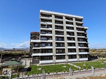 MEZİTLİ KİRALIK ANAYOLA YAKIN GENİŞ BALKONLU SIFIR 1+1 DAİRE