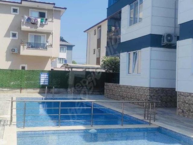 MİNE EMLAKTAN HAVUZLU SİTEDE 1+1 EŞYALI KİRALIK DAİRE