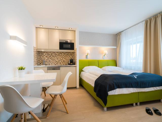 Micro apartment with air conditioning in convenient location near City Airport Train