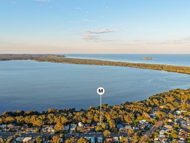 Mid century dream on tranquil waterfront reserve