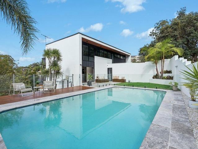 Mid century entertainer of striking tri level design