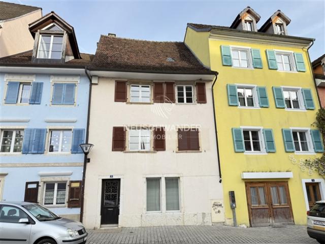 Miethaus mit 2 Wohnungen und 1 Geschäft zum Verkauf in Delémont