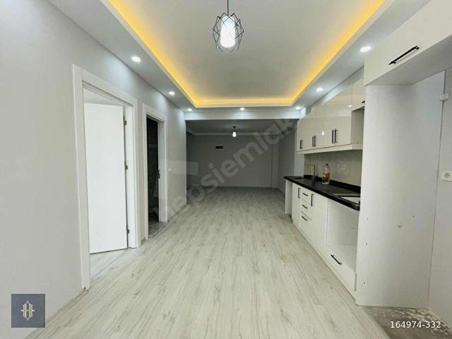 Milas Gümüşlük'te Satılık 1+1 Daire Harmaya Real Estate