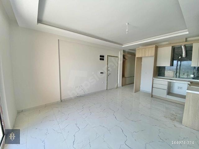 Milas Güneş mahallesinde Satılık 2+1 Daire Harmaya Real Estate