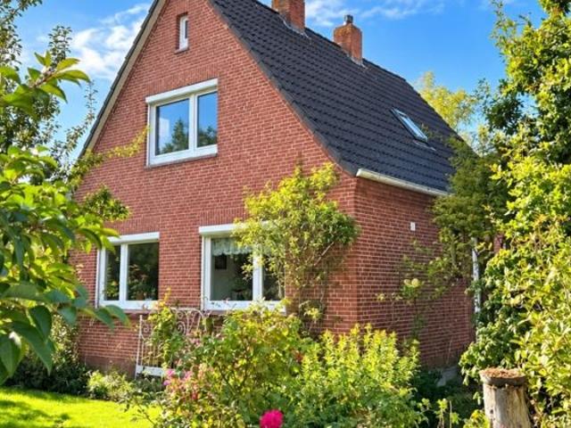 Mit Mühlenblick: Gemütliches Einfamilienhaus mit Garage und hübschem Garten in ruhiger Wohnlage