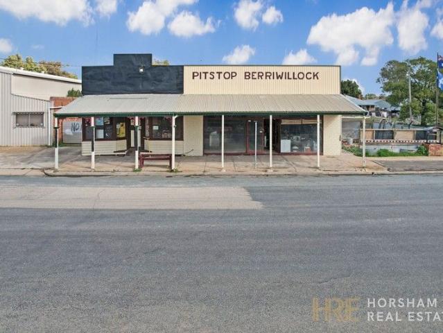Mixed use property with home, shopfronts, and shed