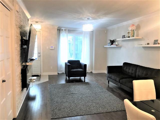 Montreal Furnished Townhouse Rental 2 Bedroom, 1.5 Bathroom with Balcony and Lovely Furnishings in Saint Javier