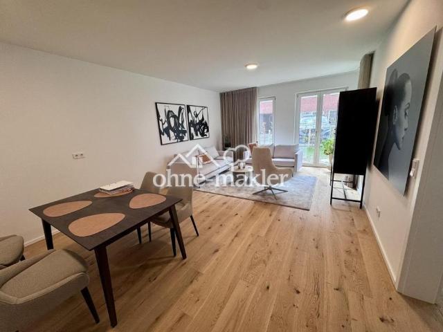 Möbelierte Neubau 2 Zimmer Wohnung mit sonniger Terrasse und Garten