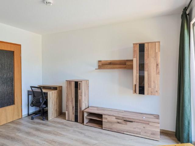 Möblierte 1 Zimmer Wohnung mit privatem Gartenanteil