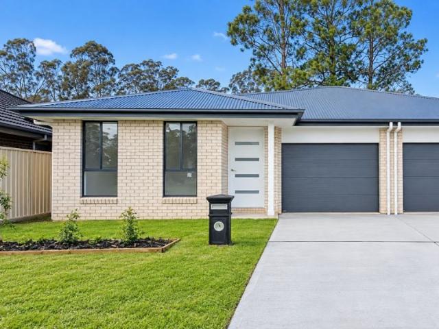 Modern 3 bedroom home in Watagan Park Ducted Air Con, Ensuite, Alfresco, 2 Living Areas