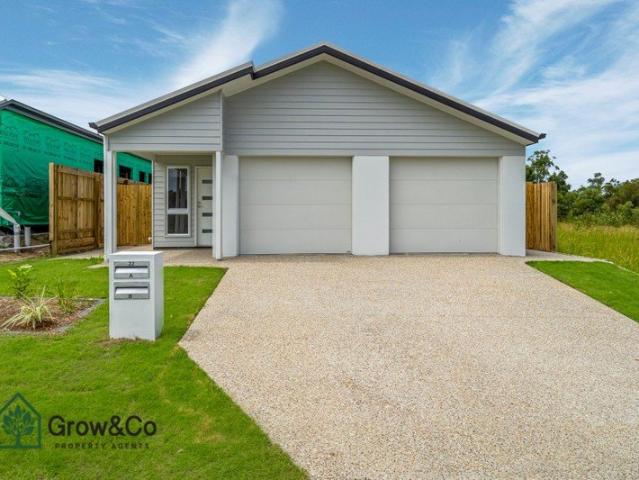 Modern 2 bedroom residence featuring a fully fenced backyard! Ready to move in!