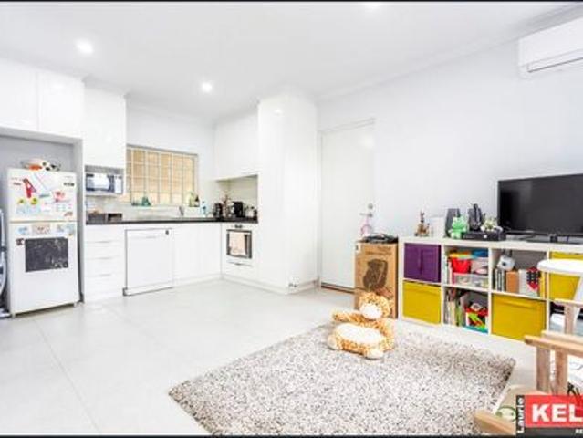 Modern 2 bedroom unit located walking distance to Belmont Forum