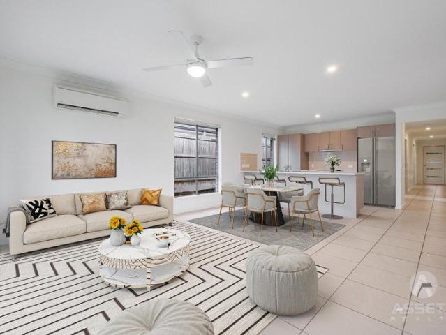 MODERN 4 BED FAMILY HOME. 2 x LIVING AREAS. IN THRIVING REDBANK PLAINS