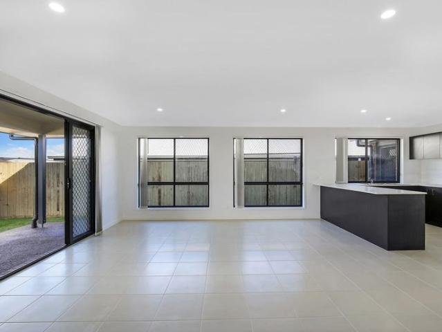 MODERN 4 BEDROOM FAMILY HOME WITH GOOD SIZE OPEN PLAN KITCHEN LIVING AREA THAT OPENS ONTO ALFRESCO DINING AREA. CLOSE TO PARKS AND WALKING TRACKS