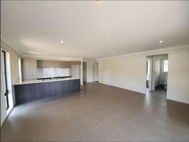 MODERN 4 BEDROOM FAMILY HOME WITH OPEN PLAN KITCHEN LIVING DINING THAT OPENS OUT ONTO AN ALFRESCO DINING AREA. VERY GOOD SIZE YARD