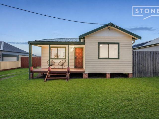 Modern cottage with large shed on a huge block