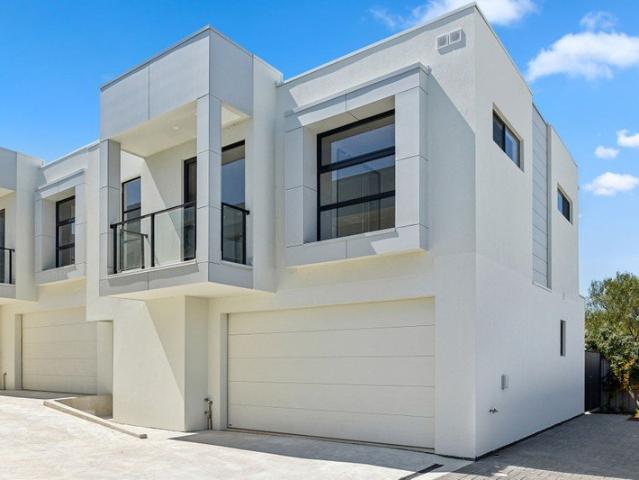Modern Coastal Living Just Moments from the Beach!