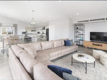 Modern Coastal Living Just Steps from the Beach!