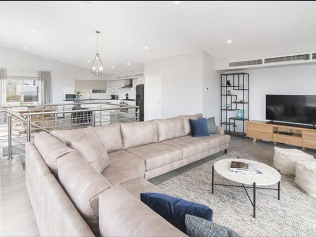 Modern Coastal Living Just Steps from the Beach!