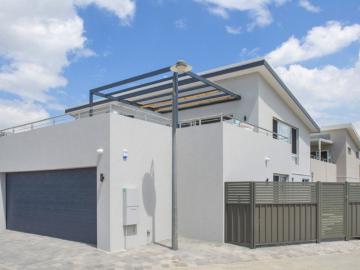 Modern Coastal Living Just Steps from the Beach!