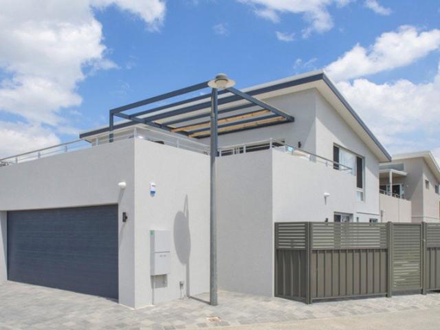 Modern Coastal Living Just Steps from the Beach!