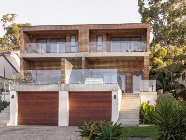Modern Architectural Masterpiece with Dual Balconies and Expansive Outdoor Living