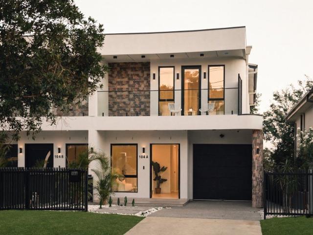 Modern Architectural Masterpiece with Dual Balconies and Striking Facade