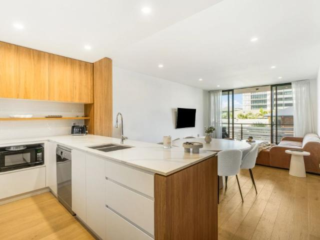 Modern Beachside Living with Rooftop Pool Access