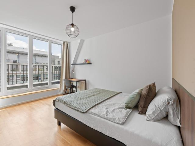 Modern double bedroom with balcony in Berlin Mitte
