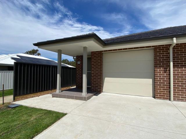 Modern duplex in sought location