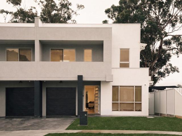 Modern Duplex with Luxurious Master Suite and Expansive Outdoor Living