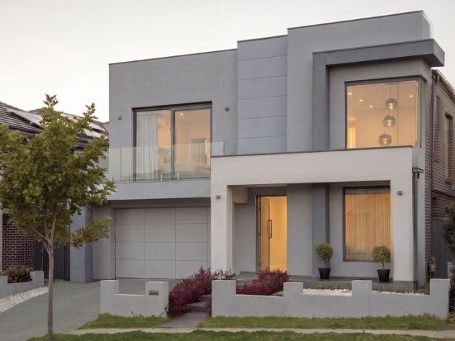 Modern Family Oasis with Home Theater and Sunroom in Prime Location