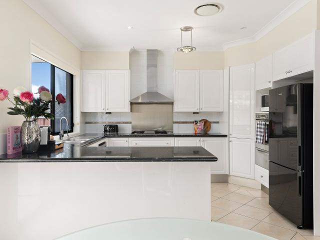 Modern family appeal in an exclusive peninsula address