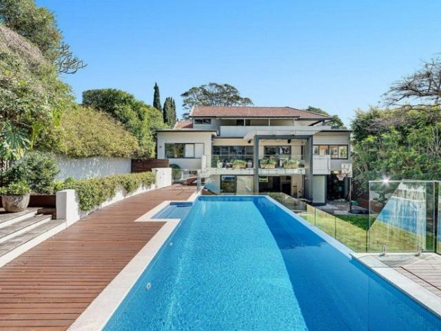 MODERN FAMILY HOME WITH WATER VIEWS ON CIRCA 980SQM