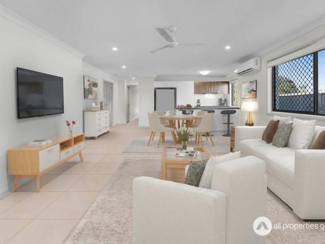 Modern Family Home with Contemporary Amenities: Stylish Corner Block Residence for Comfort and Functionality