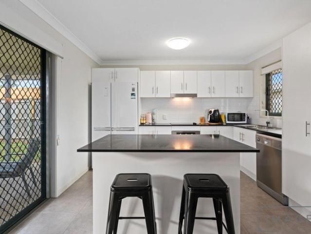 Modern Family Living with Air Conditioning, Spacious Patio & Four Bedrooms