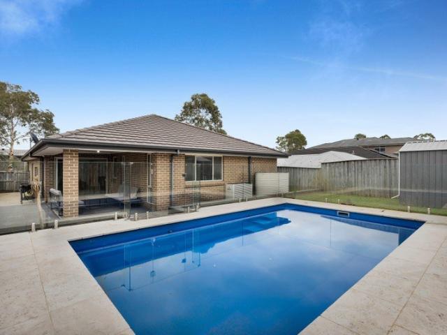 Modern family living with poolside perfection in a prime Minto location