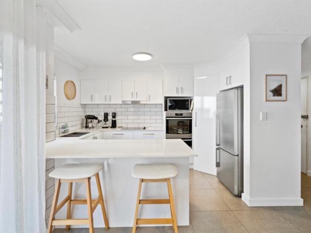Modern First Floor Living Just Moments From The Beach