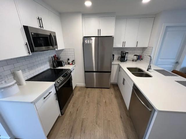 Modern & Furnished 1 Bedroom Carriage Suite in Peaceful Livingston, Calgary — 1 Bedroom Condo Unit